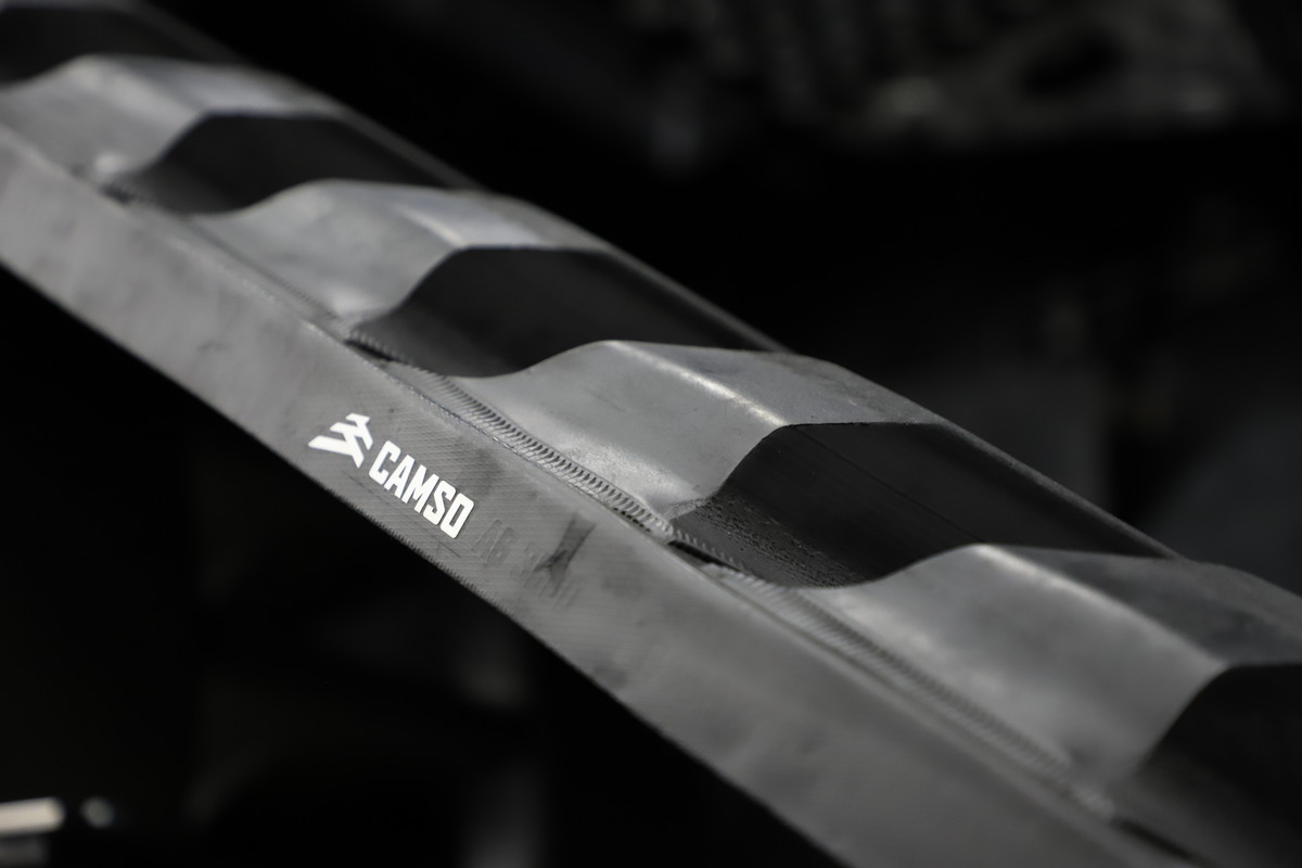 Camso track belts - parts of farming/agricultural equipment and machinery. Black background